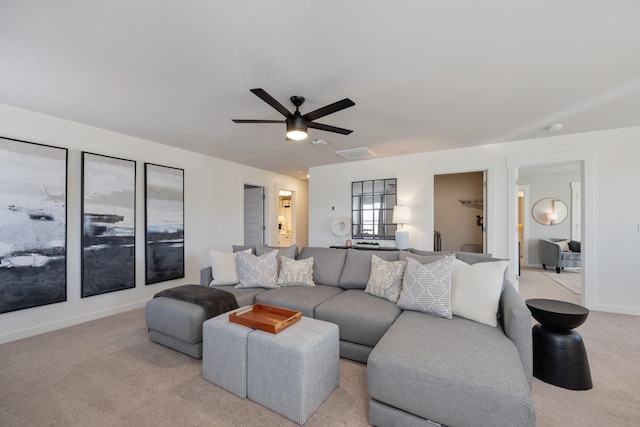 living room featuring baseboards, carpet, visible vents, and a ceiling fan