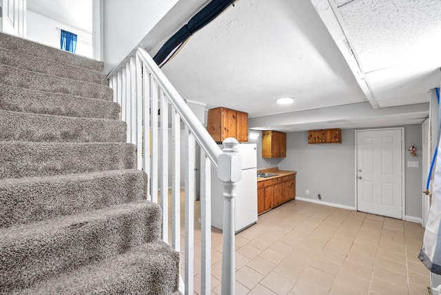 stairs featuring baseboards