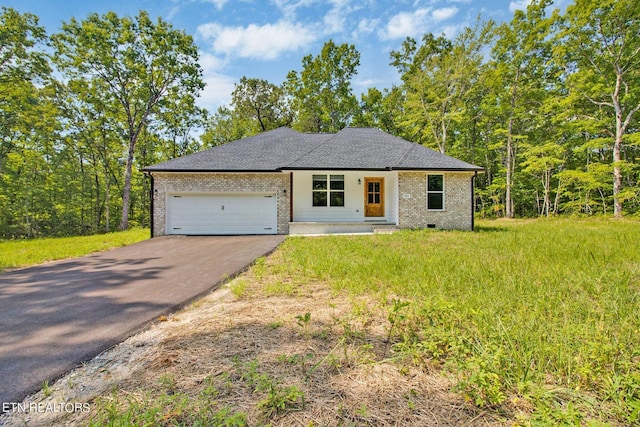 view of front of house featuring a shingled roof, aphalt driveway, an attached garage, crawl space, and brick siding