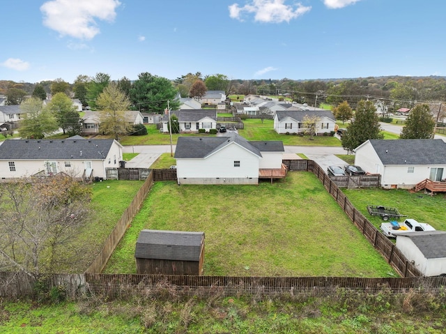 birds eye view of property with a residential view