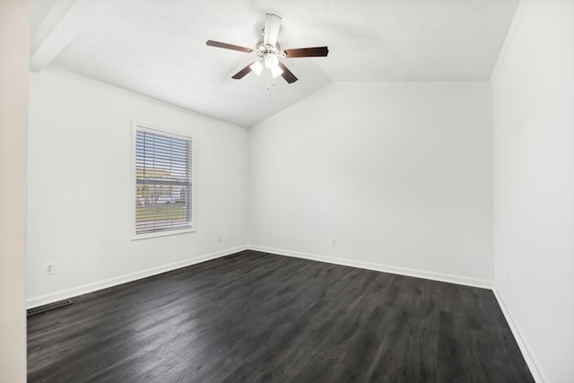 unfurnished room with baseboards, visible vents, dark wood finished floors, ceiling fan, and vaulted ceiling