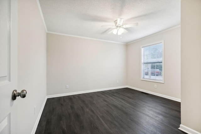 spare room featuring baseboards, visible vents, and crown molding