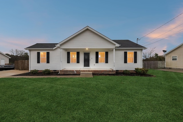 ranch-style house with crawl space, covered porch, fence, and a yard