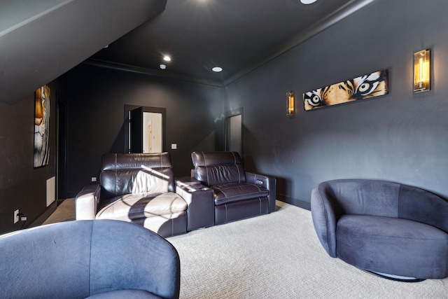 carpeted cinema with ornamental molding and recessed lighting