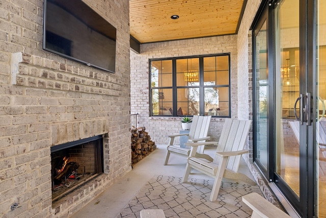 interior space featuring an outdoor brick fireplace