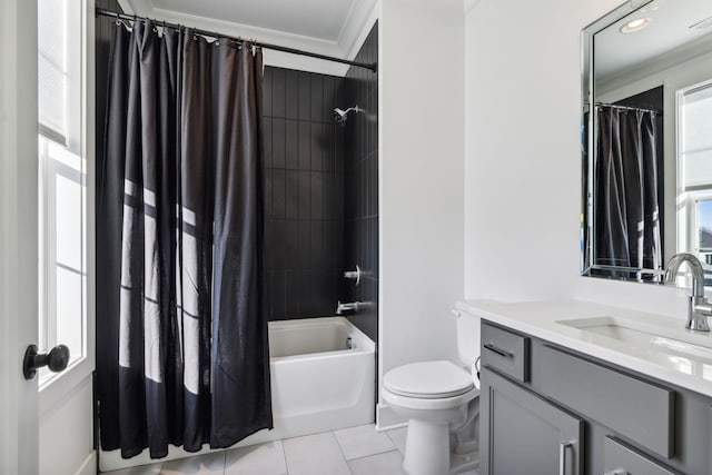 bathroom featuring crown molding, toilet, shower / bath combo with shower curtain, vanity, and tile patterned flooring