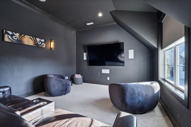 carpeted cinema room featuring ornamental molding