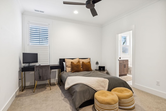 bedroom with ornamental molding, light colored carpet, and baseboards