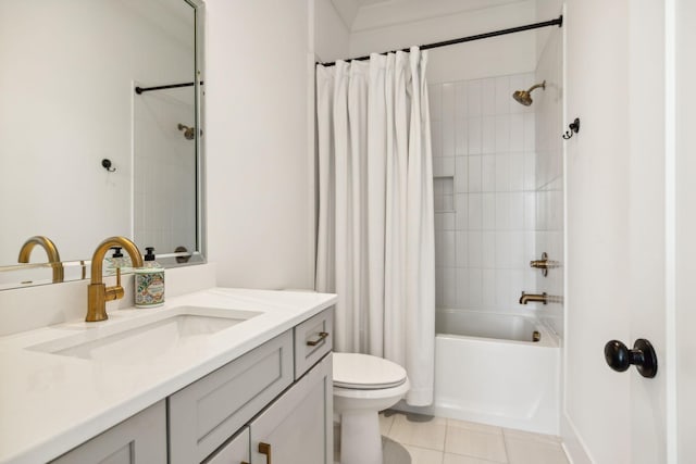 bathroom featuring shower / tub combo, vanity, toilet, and tile patterned floors