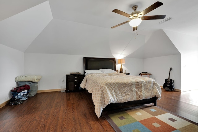 bedroom featuring baseboards, a ceiling fan, vaulted ceiling, and wood finished floors