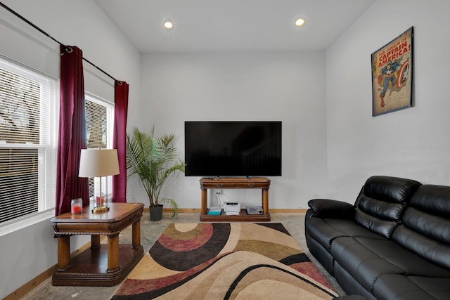 living room featuring baseboards and recessed lighting