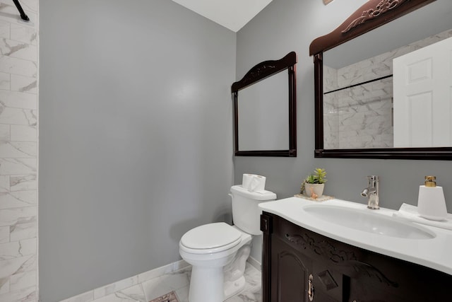 bathroom featuring baseboards, toilet, marble finish floor, walk in shower, and vanity