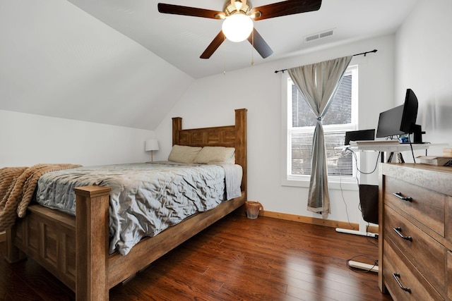 bedroom featuring baseboards, visible vents, a ceiling fan, lofted ceiling, and hardwood / wood-style floors