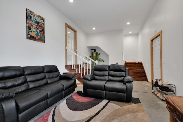 living area featuring recessed lighting and stairway