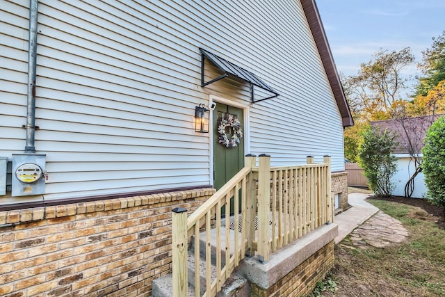 doorway to property with fence