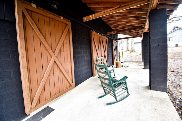 view of patio / terrace with an outbuilding and an exterior structure