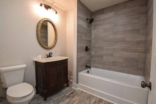 full bathroom with toilet, wood finished floors, vanity, baseboards, and  shower combination