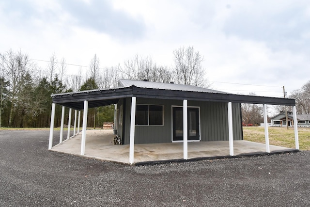 exterior space with a carport