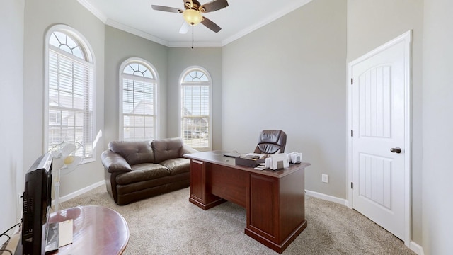 home office featuring light carpet, crown molding, and baseboards