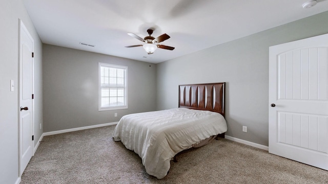 bedroom featuring ceiling fan, carpet floors, visible vents, and baseboards