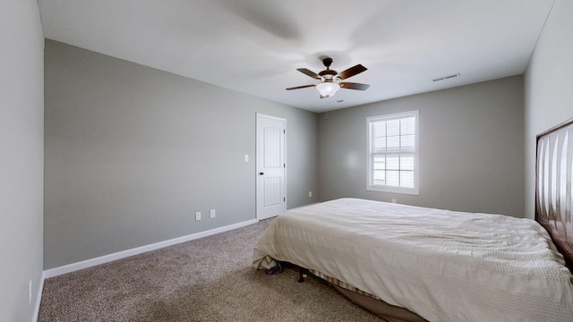 bedroom featuring ceiling fan, carpet floors, visible vents, and baseboards