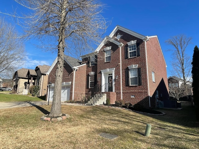 view of front of home featuring brick siding, concrete driveway, crawl space, a garage, and a front lawn