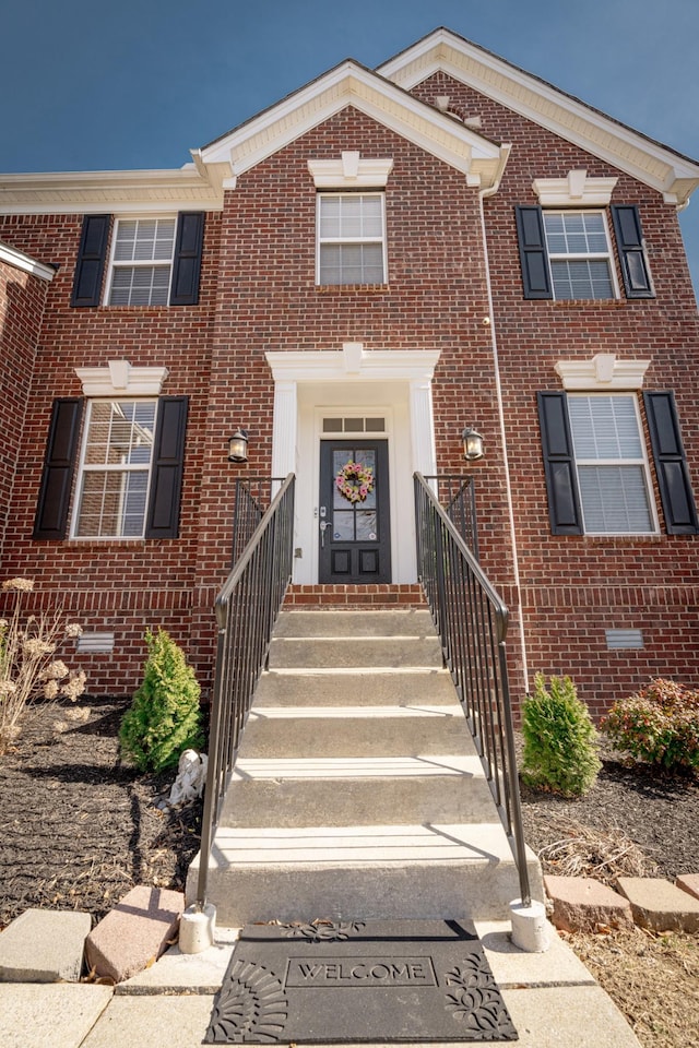 view of front facade featuring brick siding