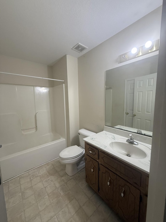 bathroom with shower / bath combination, visible vents, toilet, vanity, and a textured ceiling