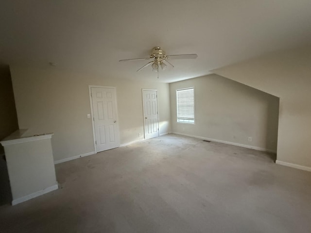 additional living space featuring a ceiling fan, carpet floors, and baseboards