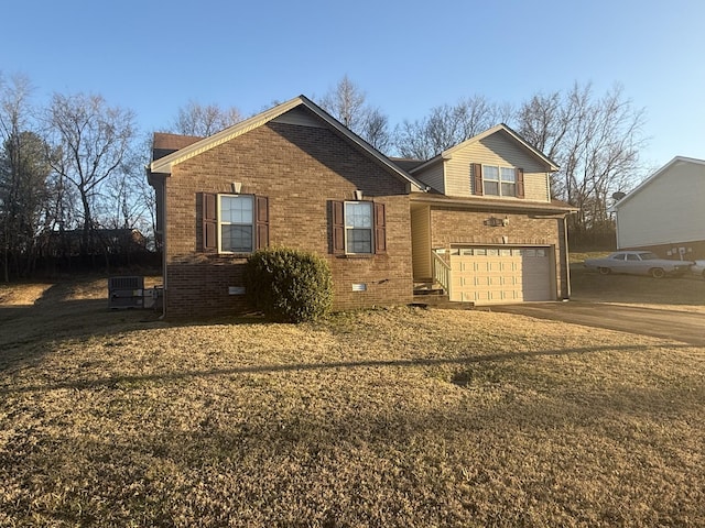 view of front facade featuring concrete driveway, brick siding, crawl space, and an attached garage