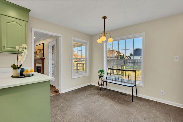 dining room featuring visible vents and baseboards