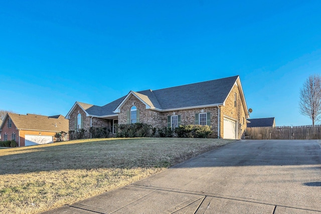 single story home with brick siding, concrete driveway, a front yard, fence, and a garage