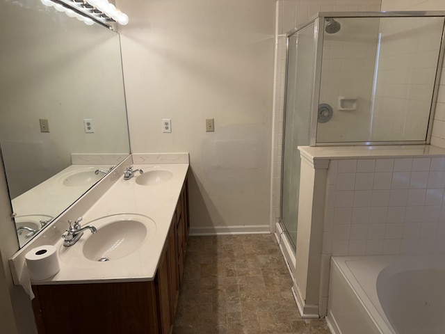 full bath featuring a sink, a shower stall, and a bath