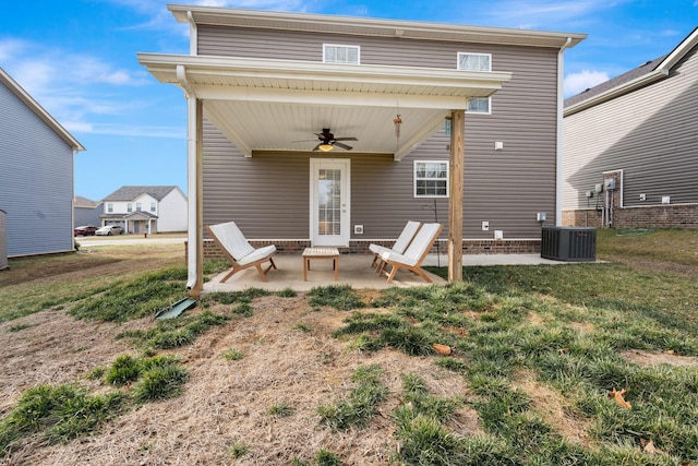 back of house featuring a ceiling fan, a yard, a patio, and central AC unit