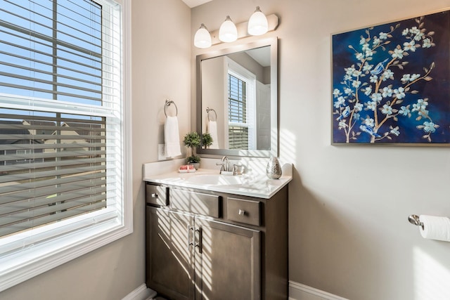 bathroom with vanity and baseboards