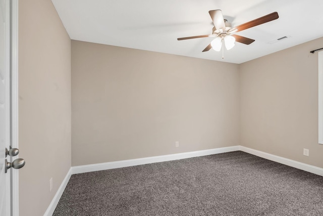 carpeted empty room with ceiling fan, visible vents, and baseboards