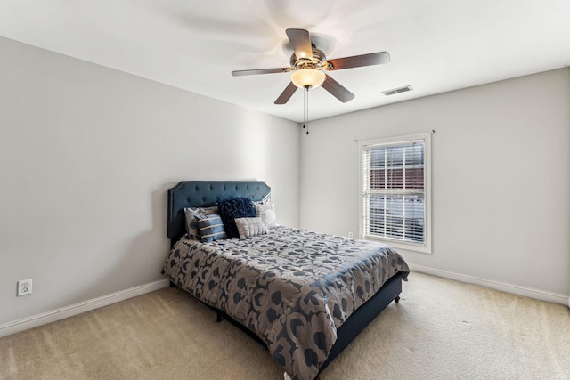 bedroom featuring ceiling fan, carpet flooring, visible vents, and baseboards