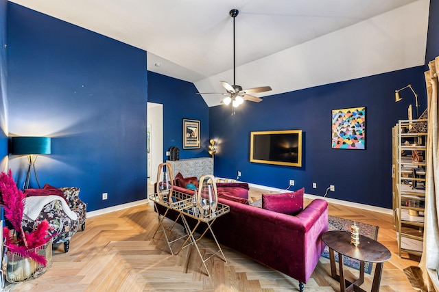 living room with baseboards, vaulted ceiling, and a ceiling fan