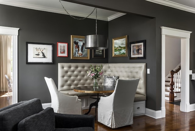 dining space with ornamental molding, stairway, wood finished floors, and baseboards