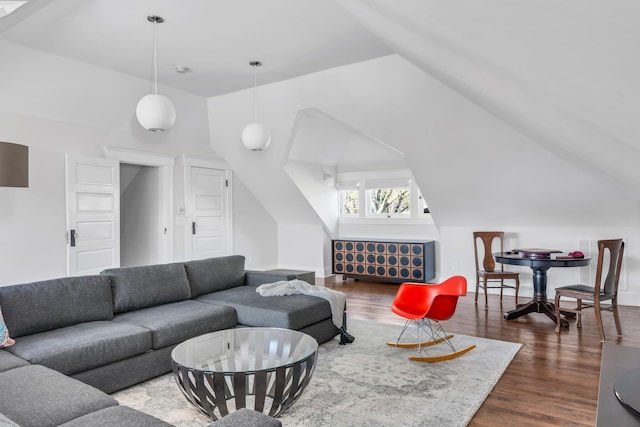 living area with lofted ceiling and dark wood finished floors