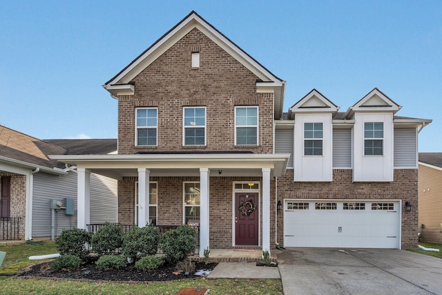 traditional-style home with driveway, brick siding, a porch, and an attached garage