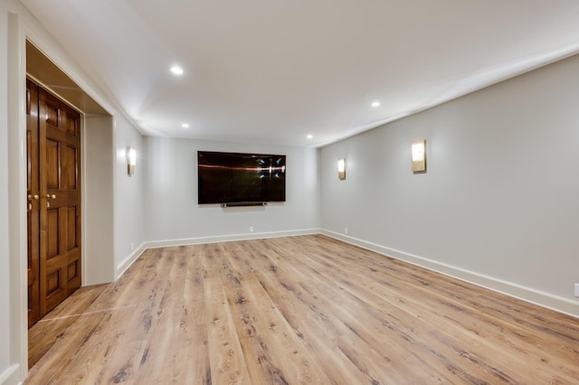 interior space with baseboards, recessed lighting, and light wood-style floors