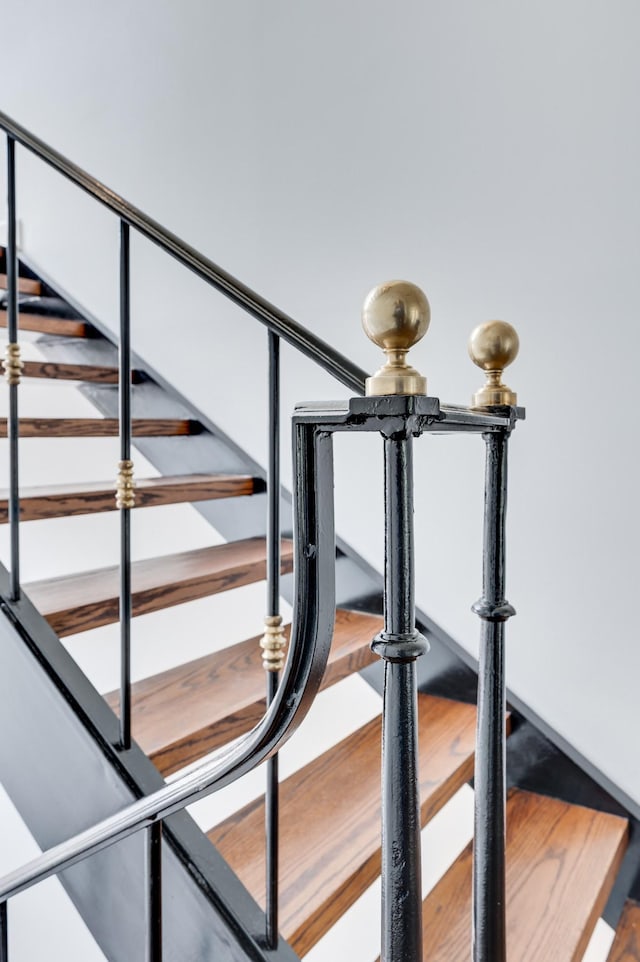 stairway with wood finished floors