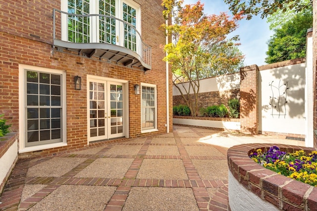 view of patio / terrace with french doors and fence