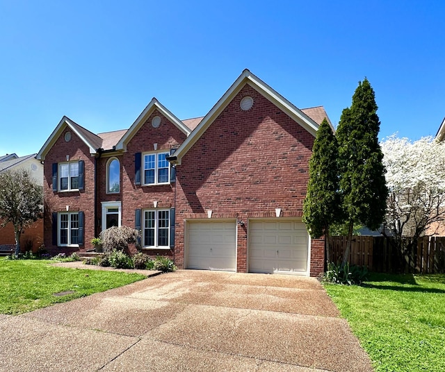 traditional home featuring brick siding, fence, and driveway