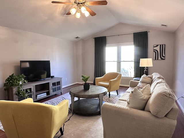 living room featuring vaulted ceiling, ceiling fan, and baseboards