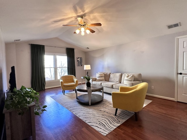 living area with wood finished floors, visible vents, baseboards, vaulted ceiling, and a ceiling fan