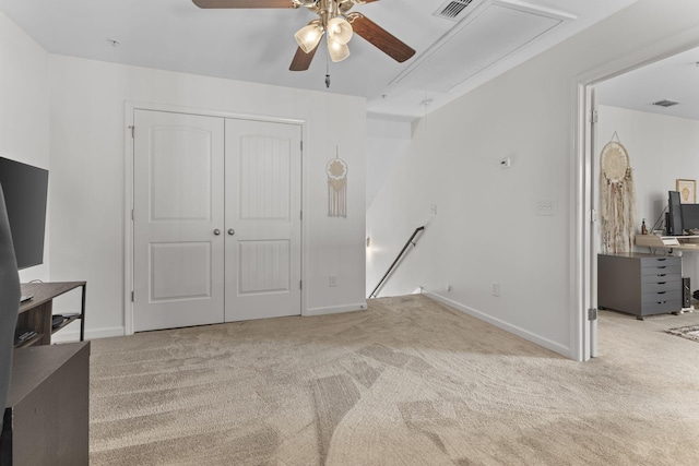 interior space with a closet, carpet, and visible vents