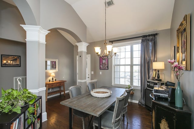 dining area with arched walkways, lofted ceiling, dark wood-type flooring, visible vents, and decorative columns