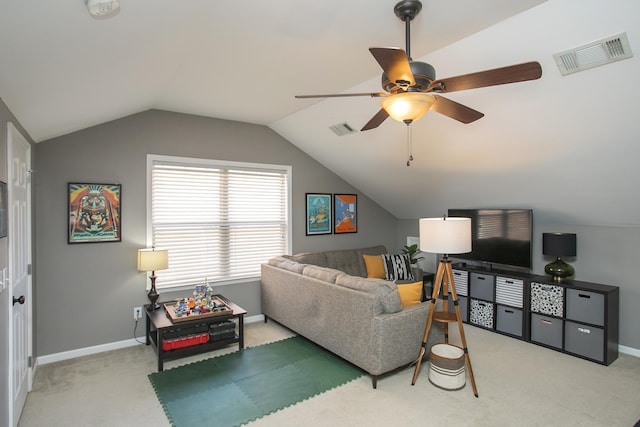 living area featuring visible vents, vaulted ceiling, light carpet, and baseboards